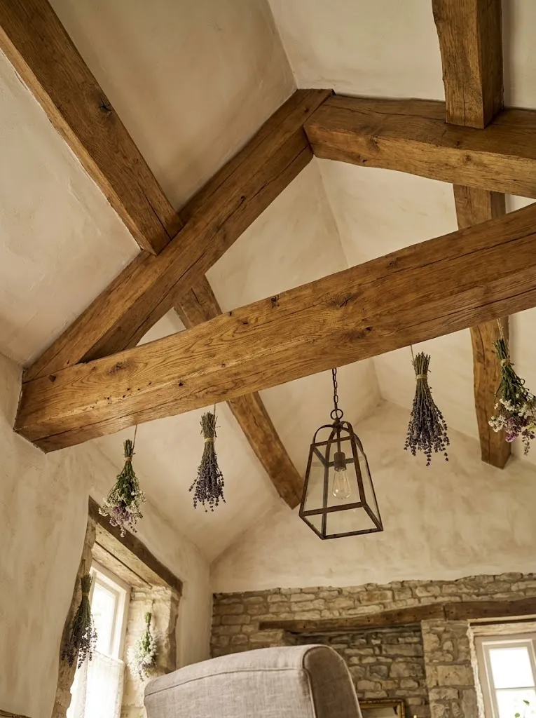 Exposed wooden beams in a cottagecore style home ceiling